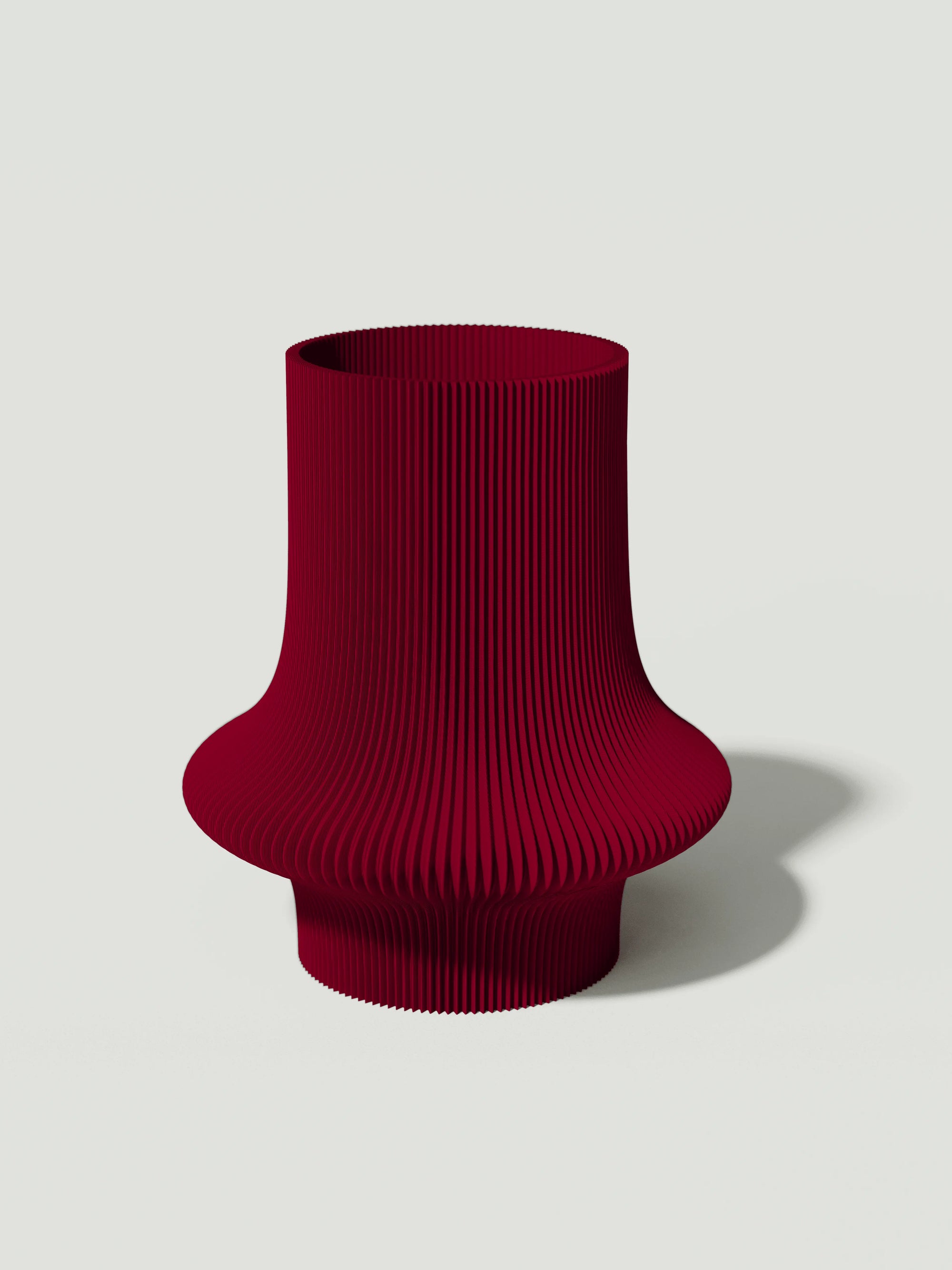 Vio - Vaso elegante e sostenibile, realizzato in 100% PLA biodegradabile, stampato in 3D e Made in Italy. Il suo design raffinato ed ecologico in bordeaux aggiunge un tocco di stile e sostenibilità a qualsiasi ambiente.