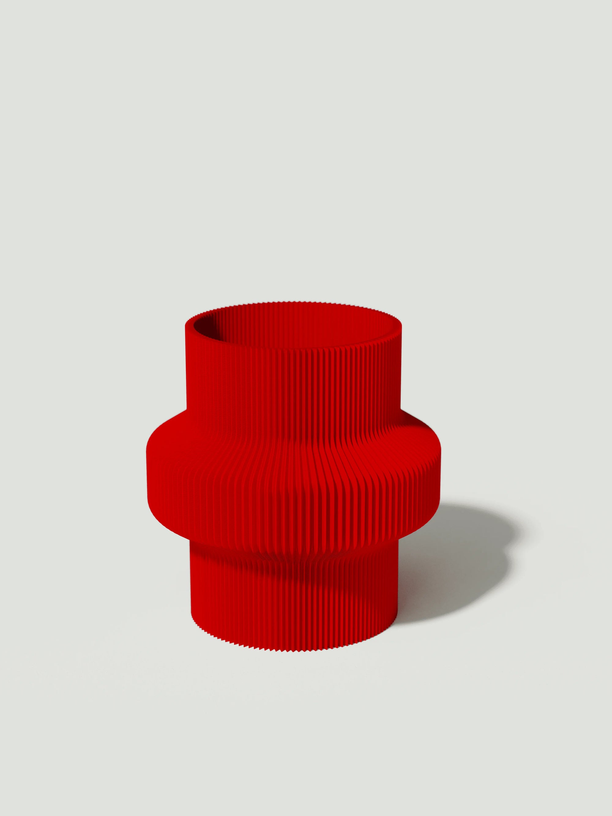 Tuc - Vaso elegante e sostenibile, realizzato in 100% PLA biodegradabile, stampato in 3D e Made in Italy. Il suo design raffinato ed ecologico in rosso aggiunge un tocco di stile e sostenibilità a qualsiasi ambiente.