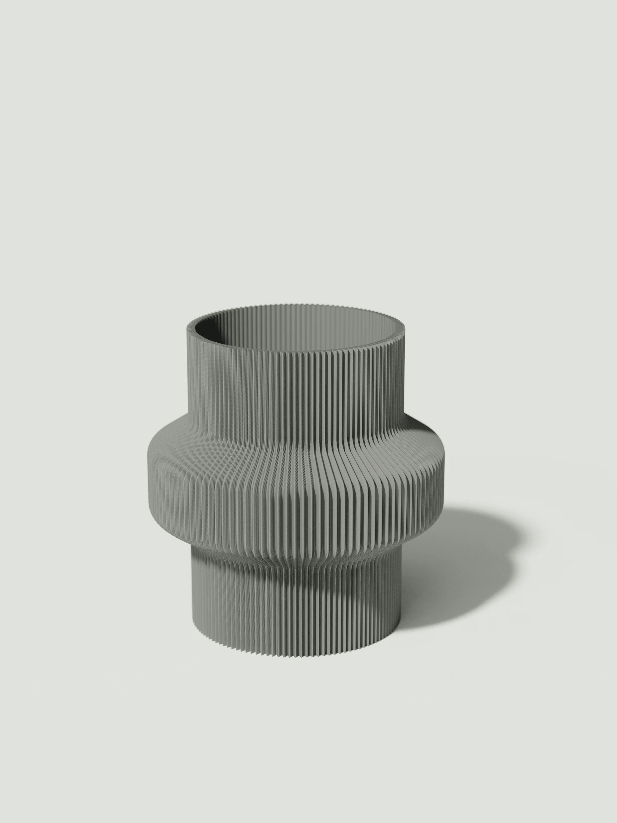 Tuc - Vaso elegante e sostenibile, realizzato in 100% PLA biodegradabile, stampato in 3D e Made in Italy. Il suo design raffinato ed ecologico in grigio aggiunge un tocco di stile e sostenibilità a qualsiasi ambiente.