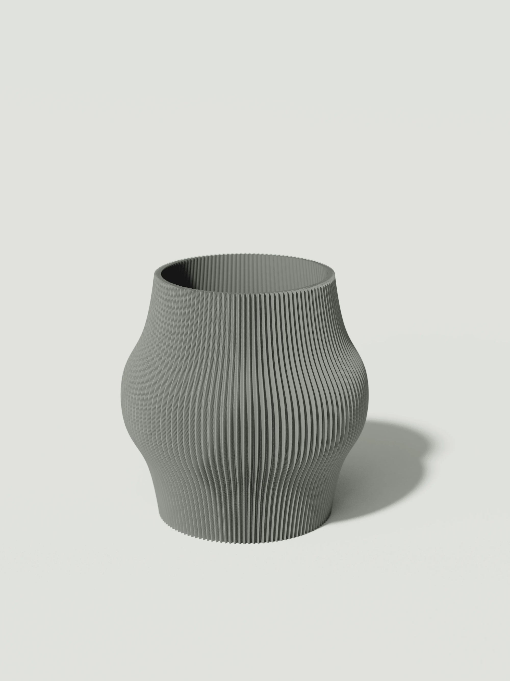 Gordo - Vaso elegante e sostenibile, realizzato in 100% PLA biodegradabile, stampato in 3D e Made in Italy. Il suo design raffinato ed ecologico in grigio aggiunge un tocco di stile e sostenibilità a qualsiasi ambiente.