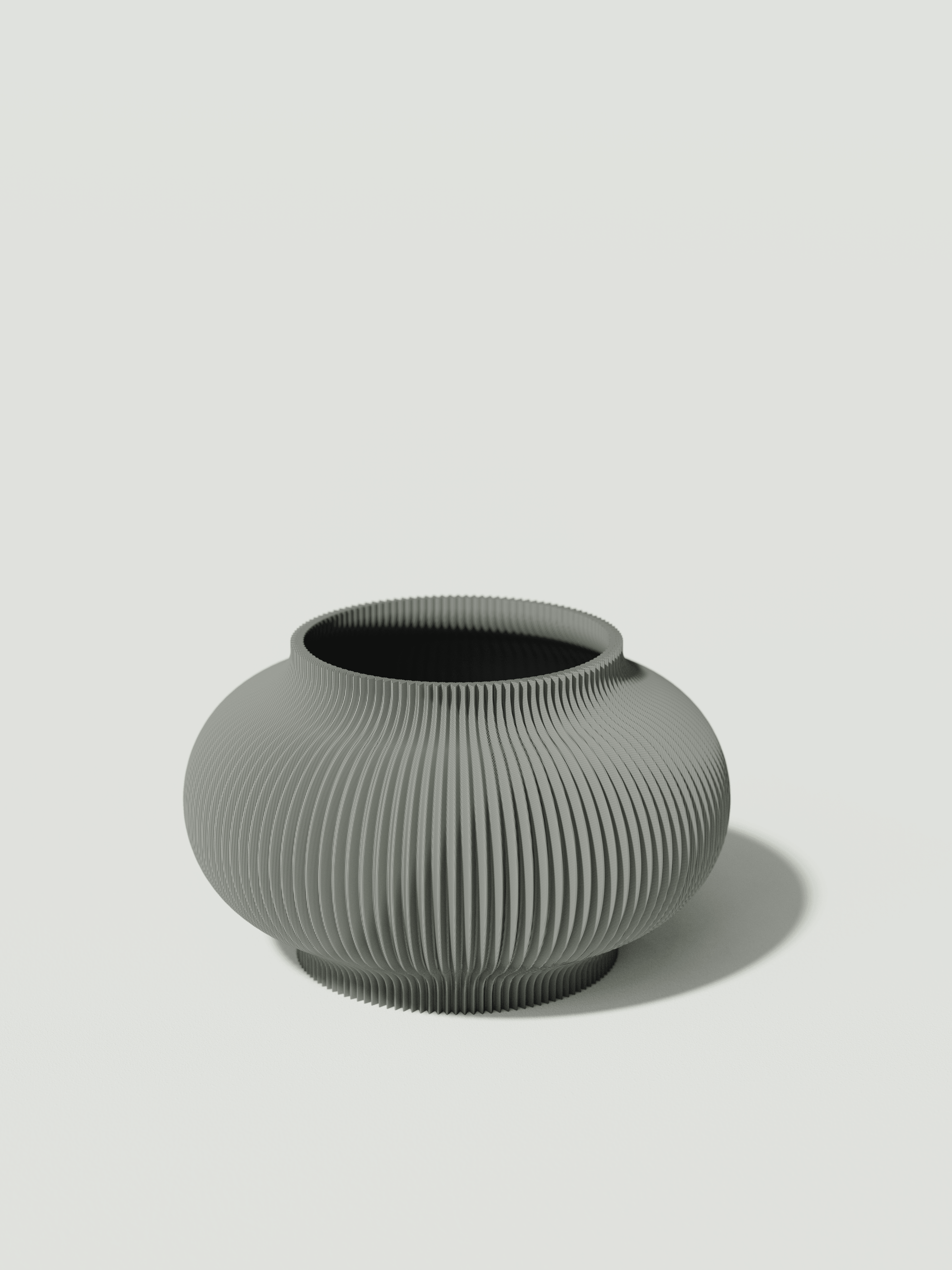 Bao - Vaso elegante e sostenibile, realizzato in 100% PLA biodegradabile, stampato in 3D e Made in Italy. Il suo design raffinato ed ecologico in grigio aggiunge un tocco di stile e sostenibilità a qualsiasi ambiente.