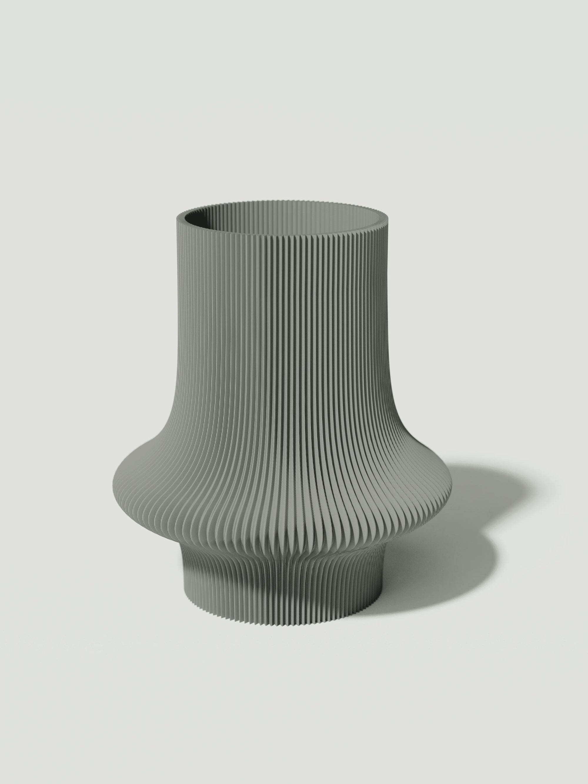 Vio - Vaso elegante e sostenibile, realizzato in 100% PLA biodegradabile, stampato in 3D e Made in Italy. Il suo design raffinato ed ecologico in grigio aggiunge un tocco di stile e sostenibilità a qualsiasi ambiente.