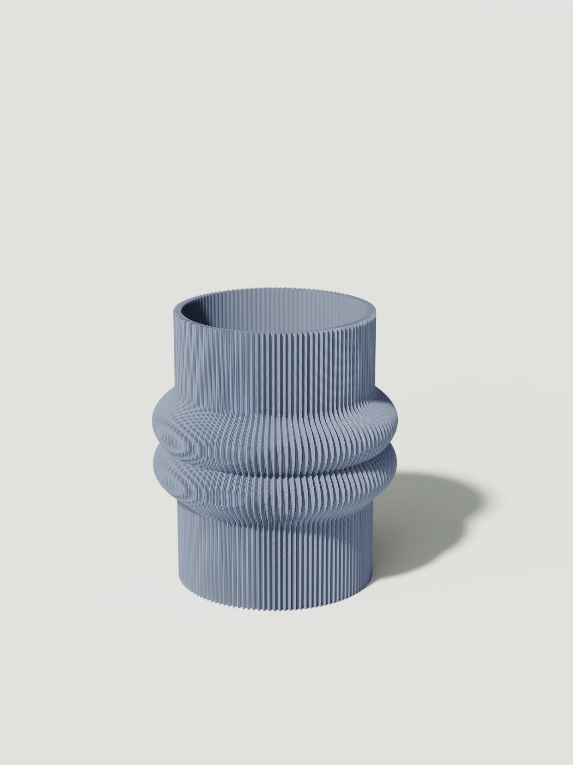 Mooi - Vaso elegante e sostenibile, realizzato in 100% PLA biodegradabile, stampato in 3D e Made in Italy. Il suo design raffinato ed ecologico in celeste aggiunge un tocco di stile e sostenibilità a qualsiasi ambiente.