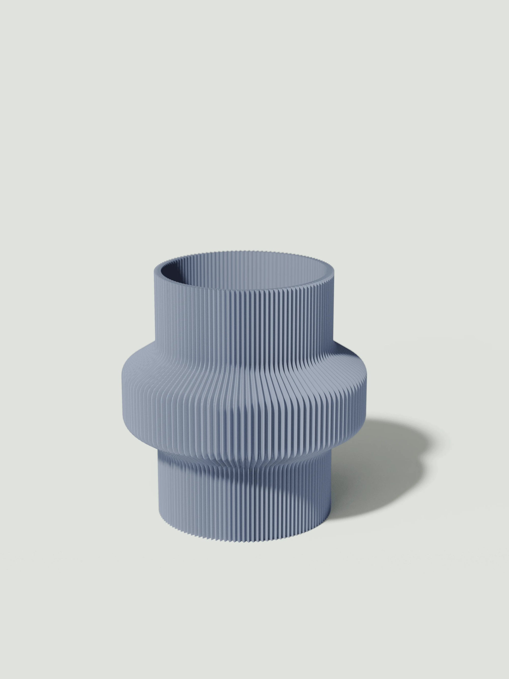 Tuc - Vaso elegante e sostenibile, realizzato in 100% PLA biodegradabile, stampato in 3D e Made in Italy. Il suo design raffinato ed ecologico in celeste aggiunge un tocco di stile e sostenibilità a qualsiasi ambiente.